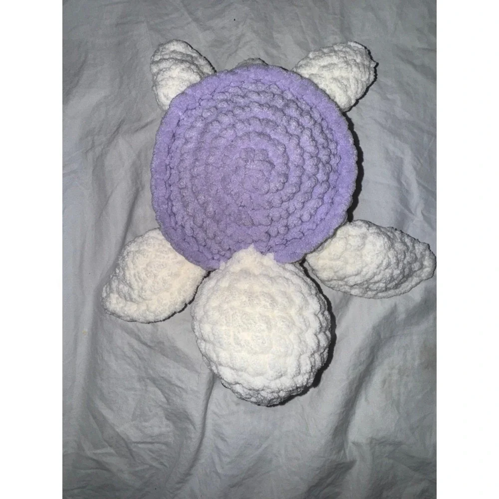 Hand crocheted‎ baby sea turtle white body and lilac purple shell.